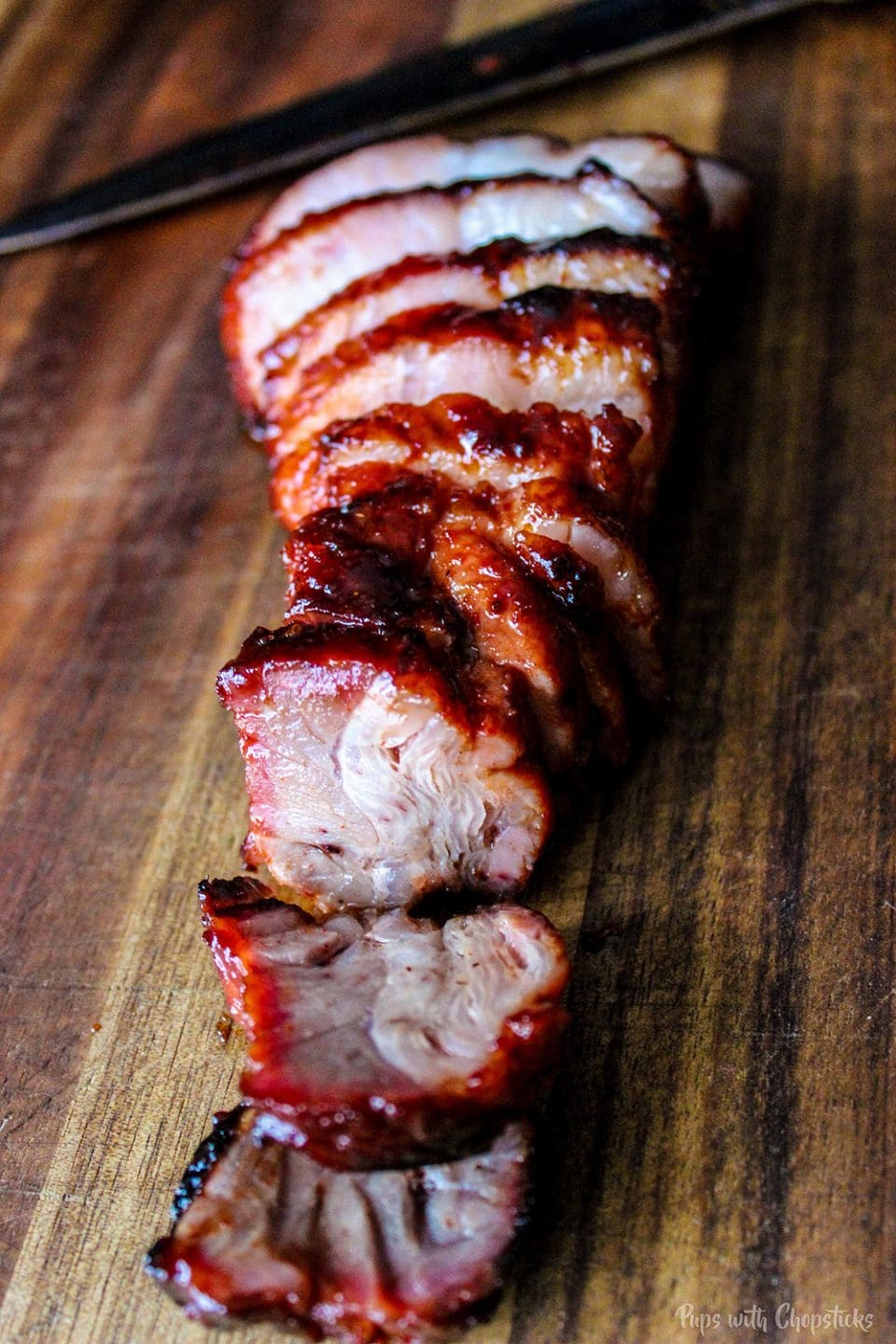 char siu meat sliced on a cutting board