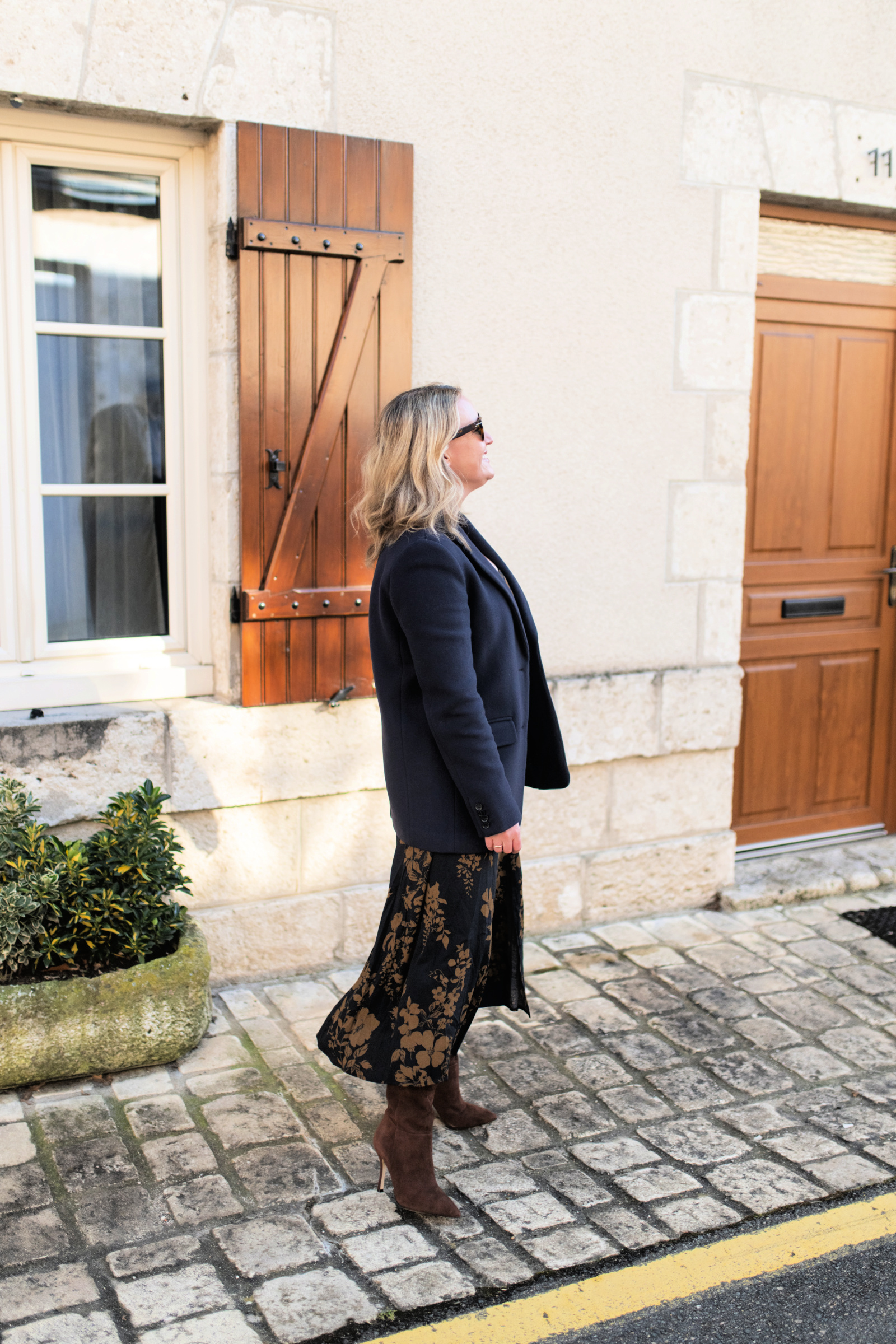  Wit Whimsy Blogger Meghan Donovan shares Winter Outfit Ideas - woman wearing coate, dress and Larroude Boot France Outfit