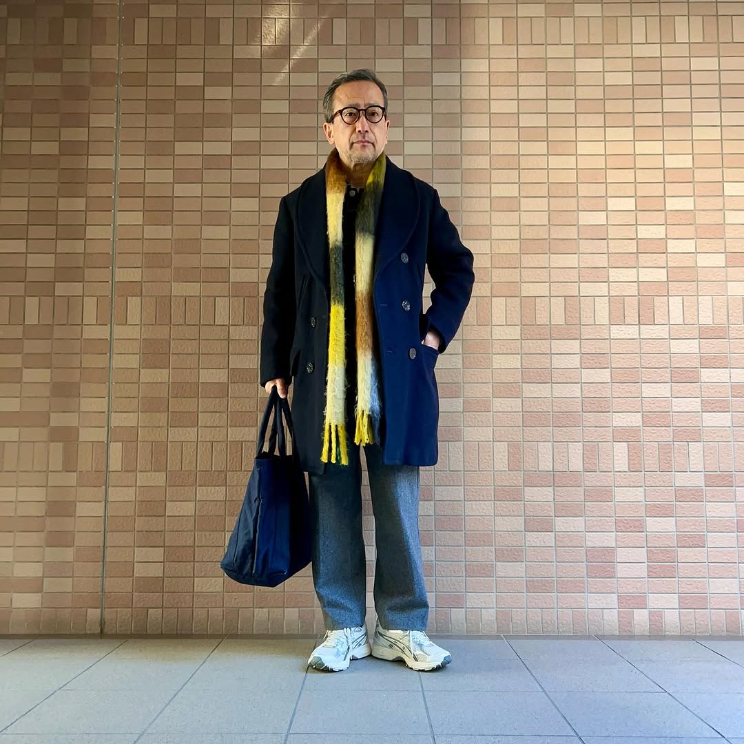 stylish man wearing a business casual outfit with asics sneakers